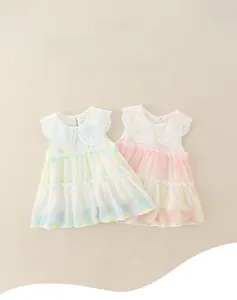 Detail of baby girl summer dresses with embroidered Peter Pan collars and tiered ruffles