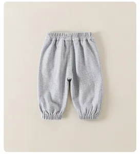 Close-up of light gray toddler pants showing elastic waistband and knit fabric texture
