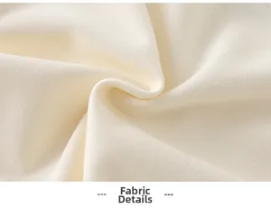 Macro detail of soft cream-colored knitted cotton fabric with a cozy fleece texture
