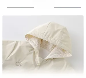 Detail of baby hooded jacket with floral lining and comfortable chin guard design
