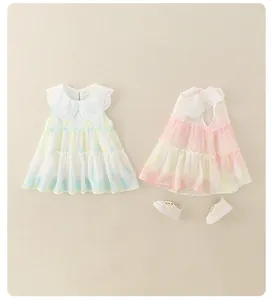 Detail of baby girl's summer dress with lace collar and soft watercolor plissé fabric