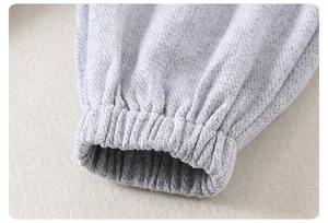 Detailed macro view of light gray toddler casual pants with elasticized ribbed cuffs