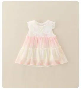 Detail of baby girl sleeveless dress featuring white lace collar and pink gradient ruffles