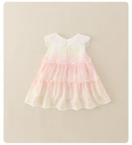 Detail of the pink and yellow gradient tiered dress with white lace collar