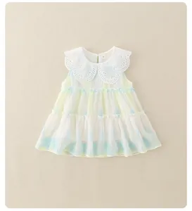 Detail of baby girl's dress with white lace Peter Pan collar and ruffled tiered skirt