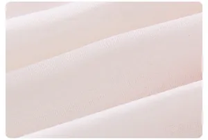 Close-up of lightweight breathable mesh fabric texture on summer dress for girls