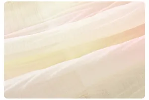 Close-up of lightweight breathable gradient pink fabric texture for summer girls dress