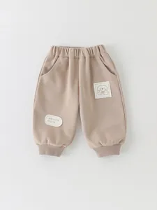 Cute cartoon puppy patch toddler joggers in soft cotton khaki with elastic waist