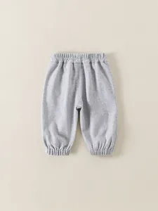 Toddler boys casual off-white knitted trousers with elastic waist and ribbed cuffs