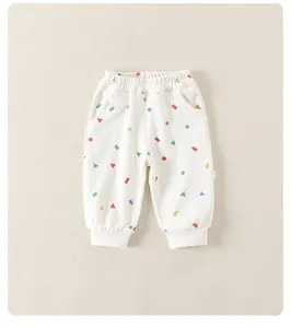 Detail of baby pants with colorful geometric prints and elastic waistband for comfort