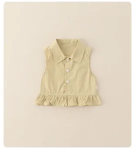 Detail of girls beige sleeveless shirt with small lapels and ruffled peplum hem