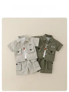 Detail view of boys cargo outfit sets in olive and beige with utility pockets