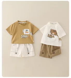 Flat lay of two cotton sets for boys featuring cartoon dog prints and cargo shorts