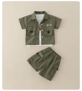 Detailed flat lay of boys' military green utility shirt and matching shorts set