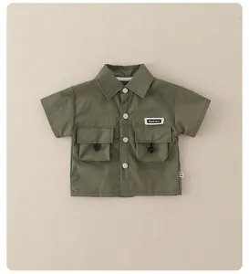 Detail of army green boys' utility shirt with button closure and chest pockets
