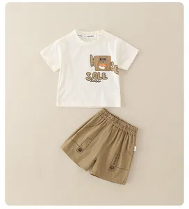 Detail of baby boys cotton summer set showing elastic waist shorts and cute pocket print