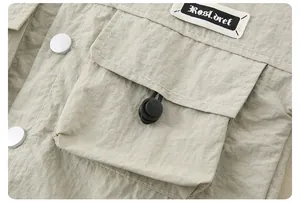 Detailed view of light khaki cargo fabric with drawstrings and Rosl.dret woven label