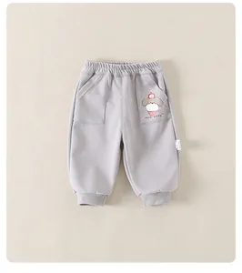 Détail du pantalon de sport gris pour tout-petit avec taille élastique et motif chiot