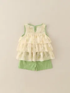 Girl summer floral sleeveless top with ruffle layers and green shorts two-piece outfit
