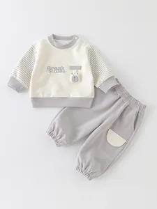 Two-piece baby track suit with bear patch and Break Rules embroidery in beige and grey