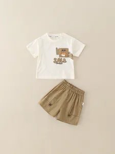 Boys summer cotton set with cream cartoon t-shirt and khaki elastic shorts