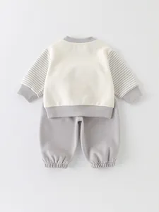 Cute cartoon toddler two-piece set featuring cream sweatshirt and grey striped pants