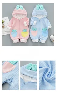 Detailed view of waffle knit fabric and cute bunny ears on baby hooded romper jumpsuit