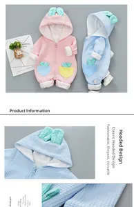 Detail view of baby waffle knit jumpsuit with bunny ears hood and polka dot lining
