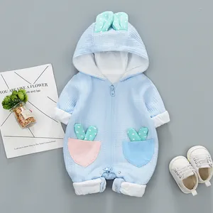 Blue waffle knit baby romper with rabbit ear hood and colorful polka dot pocket details