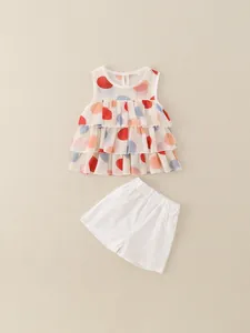 Set estivo per bambine con top smanicato in chiffon a pois e pantaloncini bianchi