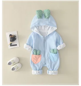 Detail of baby waffle romper featuring bunny ears hood and smooth two-way zipper