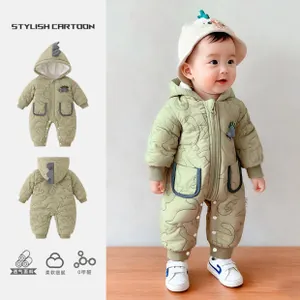 Detail of baby dinosaur quilted romper featuring breathable fabric and soft ribbed cuffs