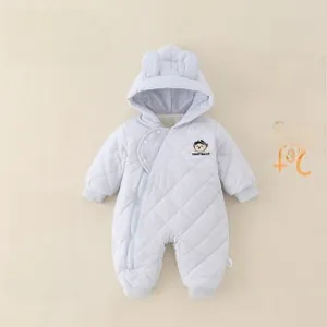 Detail of light blue quilted baby romper with bear patch and cute 3D animal ears on hood
