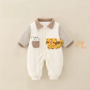 Detail of baby winter romper showing thickened cotton lining and tiger patch design