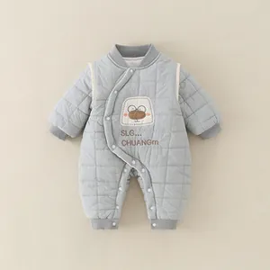 Detail of grey quilted infant romper with side snap buttons and cartoon animal embroidery