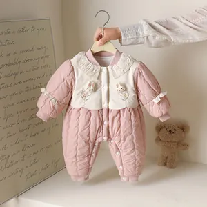 Detail of pink baby winter romper featuring delicate lace collar and rabbit embroidery