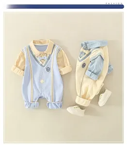 Flat lay of baby romper suit with blue vest and white sneakers for infants