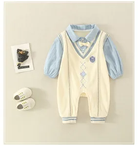 Detail view of cotton baby romper with faux-layered design and blue striped sleeves