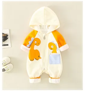 Detail view of cotton baby romper featuring a dinosaur patch and front zipper closure