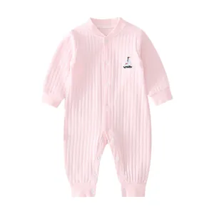 Pink newborn cotton jumpsuit featuring vertical ribbed texture and small boat embroidery