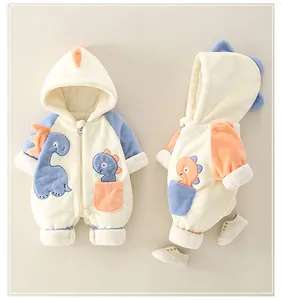 Detail of fleece baby romper featuring dinosaur embroidery and 3D fin hood design