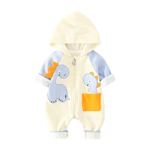 Newborn baby hooded romper with cartoon dinosaur patch and zipper closure in beige and blue