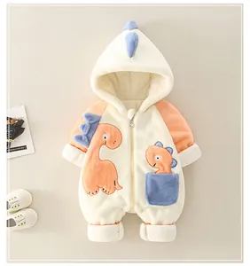 Detail of baby dinosaur romper showing soft flannel texture and zipper closure