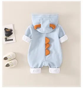 Detail showing cartoon 3D dinosaur horns and back fins on baby cotton romper hooded outfit