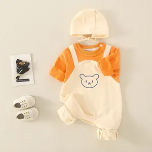 Three-piece cotton newborn outfit with orange top, bear print overalls and hat