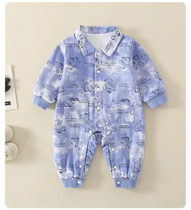 Detail of baby romper featuring blue cloud tie-dye print and teddy bear patterns
