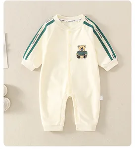 Detailed view of the ribbed neckline and snap button closure on the cotton baby bodysuit