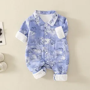 Blue tie-dye baby bodysuit with teddy bear print and ribbed texture on beige background