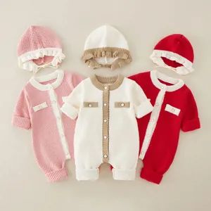 Detailed flat lay of three knitted infant rompers with matching ruffle hats in soft pastel colors
