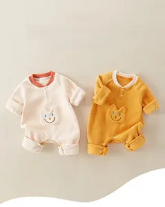 Close-up of soft A-grade cotton baby onesies with cute animal pocket details